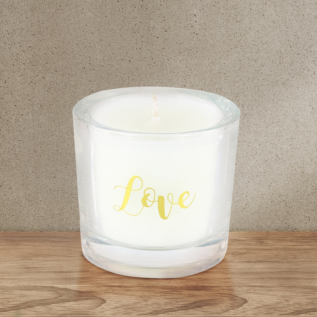 'Love' Scented Votive candle on a brown wooden table