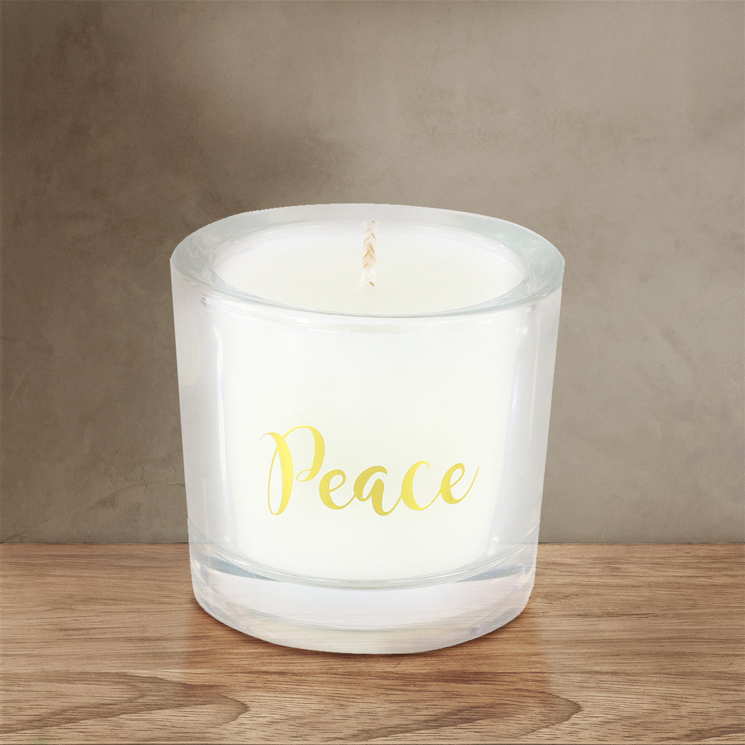 'Peace' Scented Candle on a brown wooden table