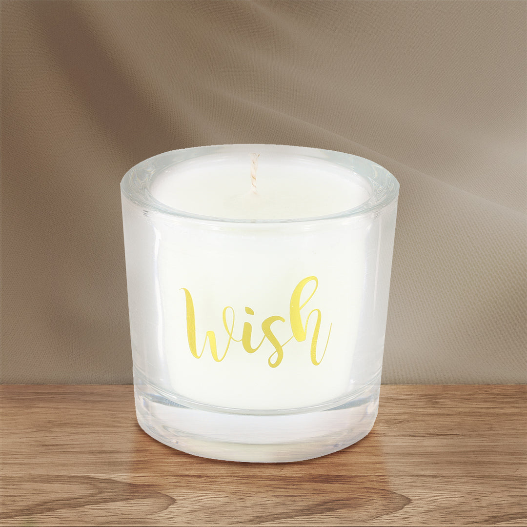 'Wish' Scented Candle on a brown wooden table