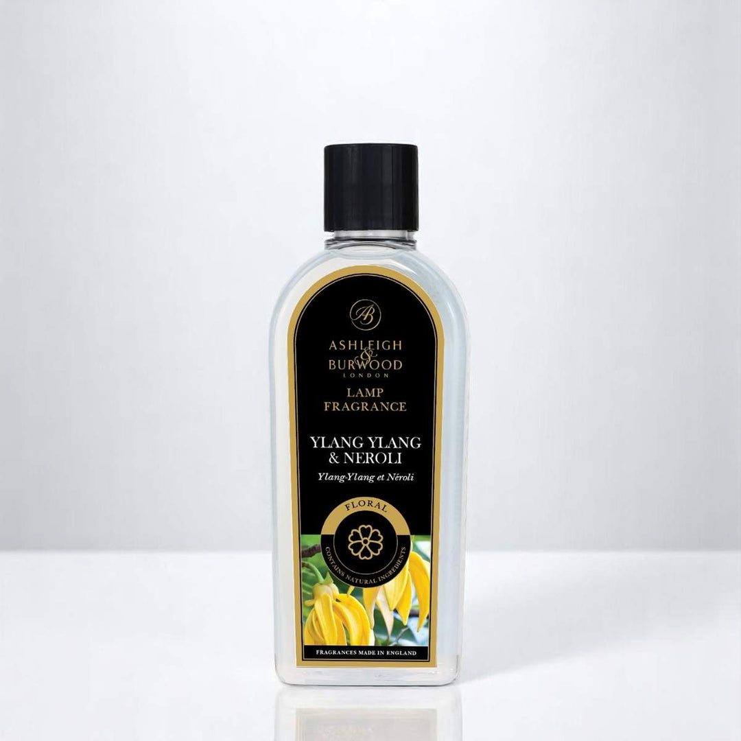 A bottle of Ylang Ylang & Neroli Lamp Fragrance on a Neutral Background