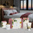 Scented home products on a table with a bedroom in the background