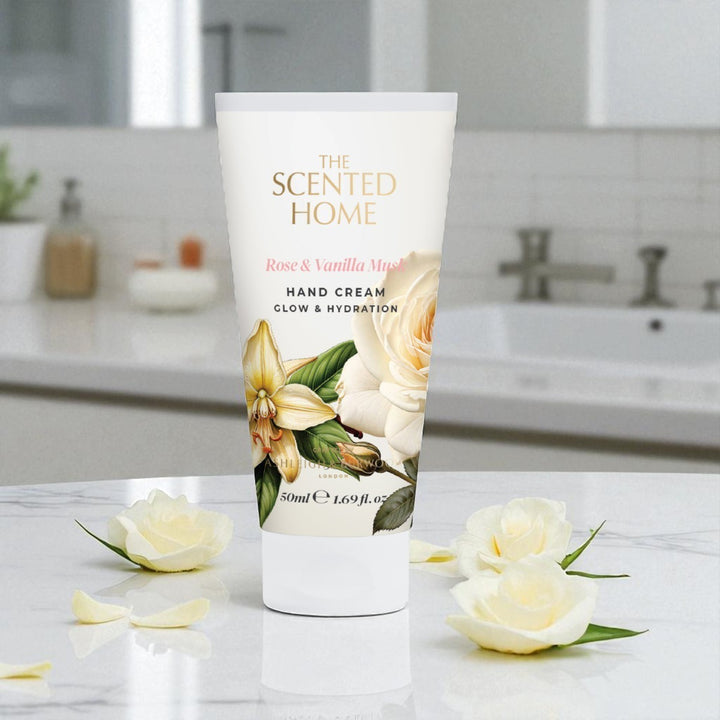 Hand cream tube labeled 'The Scented Home' with floral design on a bathroom counter.