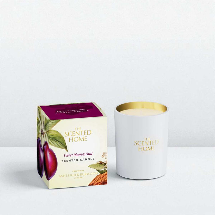 Scented candle and packaging with 'The Scented Home' branding on a white background